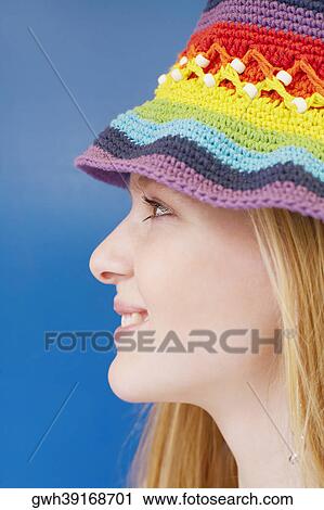 Side profile of a young woman smiling View Large Photo Image Stock Image - Side profile of a young woman smiling. Fotosearch