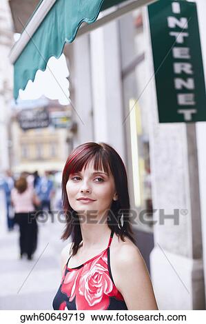 Side profile of a young woman smiling View Large Photo Image Stock Photo - Side profile of a young woman smiling . Fotosearch