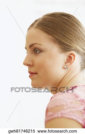 Side profile of a young woman View Large Photo Image Stock Photography - Side profile of a young woman. Fotosearch