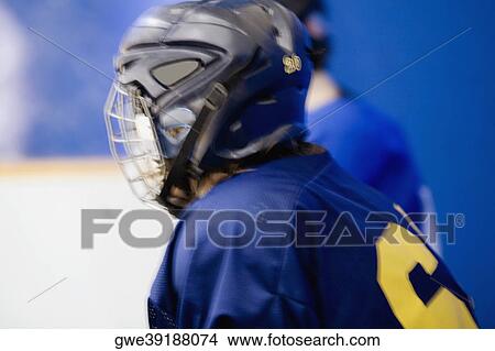 Side profile of an ice hockey player wearing a helmet View Large Photo Image Picture - Side profile of an ice hockey player wearing a helmet. Fotosearch