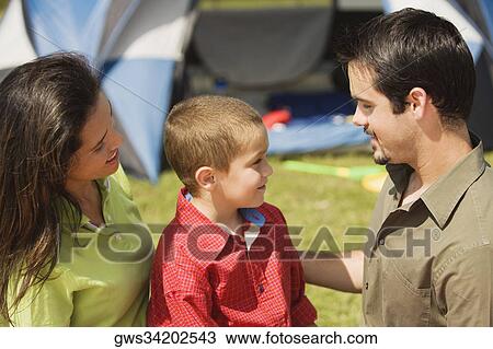 Stock Image - Side profile of parents and their son. Fotosearch