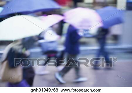 Side profile of people walking under umbrellas, Tokyo, Japan View Large Photo Image Stock Photo - Side profile of people walking under umbrellas, Tokyo, Japan. Fotosearch