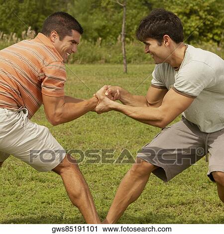 Side profile of two mid adult men playing View Large Photo Image Stock Image - Side profile of two mid adult men playing. Fotosearch