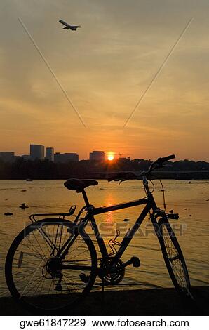 Stock Photo - Silhouette of a bicycle at dusk. Fotosearch