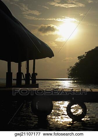 Stock Photo - Silhouette of a gazebo in the sea. Fotosearch