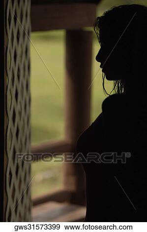 Silhouette of a young woman View Large Photo Image Stock Photo - Silhouette of a young woman. Fotosearch