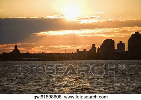 Silhouette of buildings at the waterfront, New York City, New York State, USA View Large Photo Image Stock Photo - Silhouette of buildings at the waterfront, New York City, New York State, USA. Fotosearch