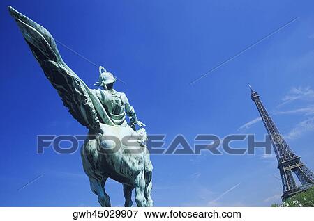 Statue in front of a tower, Eiffel Tower, Paris, France View Large Photo Image Stock Photo - Statue in front of a tower, Eiffel Tower, Paris, France. Fotosearch