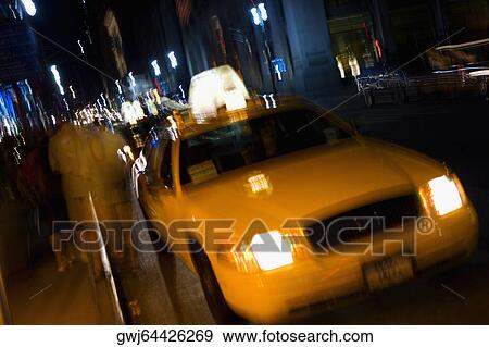 Taxi moving on the road, New York City, New York State, USA View Large Photo Image Stock Photo - Taxi moving on the road, New York City, New York State, USA. Fotosearch