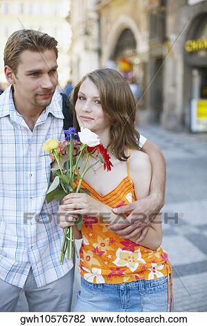 Teenage boy embracing a teenage girl View Large Photo Image Stock Image - Teenage boy embracing a teenage girl . Fotosearch