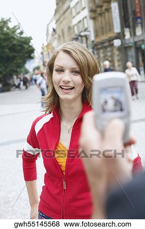 Teenage girl posing for a photograph View Large Photo Image Stock Photo - Teenage girl posing for a photograph . Fotosearch