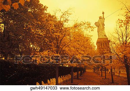 Trees in front of a statue, Statue Of Liberty, New York City, New York State, USA View Large Photo Image Stock Image - Trees in front of a statue, Statue Of Liberty, New York City, New York State, USA. Fotosearch