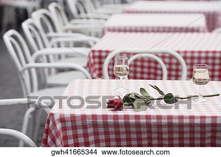 Two glasses of white wine and a rose on a table, Madrid, Spain View Large Photo Image Picture - Two glasses of white wine and a rose on a table, Madrid, Spain. Fotosearch