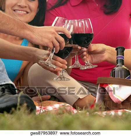 Two men and two women toasting with wineglasses View Large Photo Image Stock Photo - Two men and two women toasting with wineglasses. Fotosearch