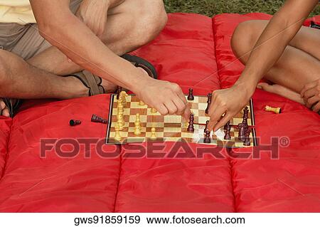 Stock Photo - Two men playing chess. Fotosearch