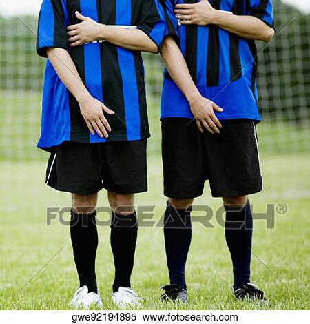 Stock Photography - Two soccer players making a wall. Fotosearch