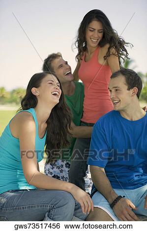 Stock Photograph - Two young couples smiling. Fotosearch