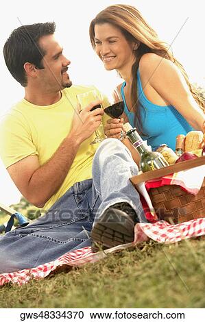 Young woman and a mature man toasting with wineglasses View Large Photo Image Stock Image - Young woman and a mature man toasting with wineglasses. Fotosearch