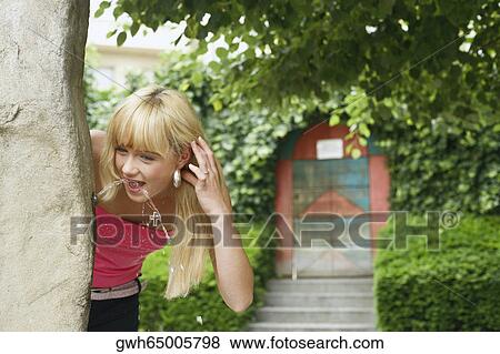 Stock Photo - Young woman drinking water . Fotosearch