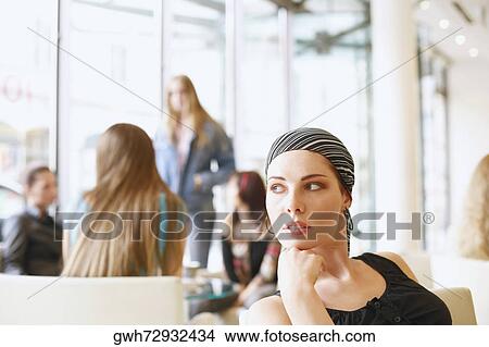 Picture - Young woman looking away. Fotosearch