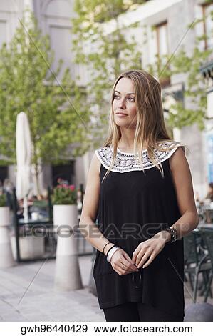Young woman looking sideways View Large Photo Image Stock Photo - Young woman looking sideways . Fotosearch