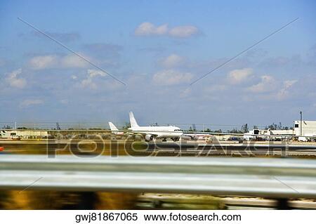 Airplanes at the airport, Miami, Florida, USA View Large Photo Image Stock Photography - Airplanes at the airport, Miami, Florida, USA. Fotosearch