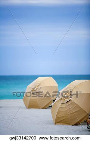 Beach umbrellas on the beach View Large Photo Image Stock Image - Beach umbrellas on the beach. Fotosearch