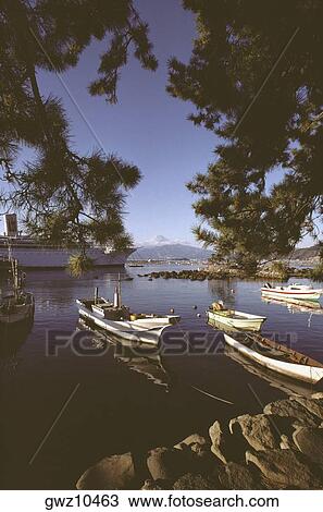 Boats in a bay with a mountain in the background, Mt Fuji, Suruga Bay, Shizuoka Prefecture, Japan View Large Photo Image Stock Image - Boats in a bay with a mountain in the background, Mt Fuji, Suruga Bay, Shizuoka Prefecture, Japan. Fotosearch