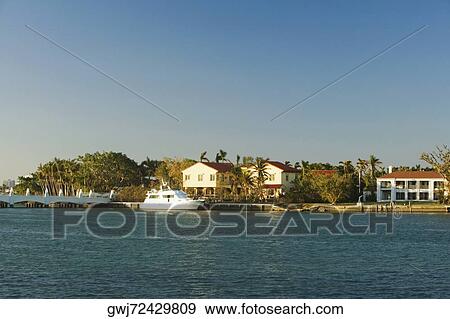 Boats moored at a dock, Miami, Florida, USA View Large Photo Image Stock Photo - Boats moored at a dock, Miami, Florida, USA. Fotosearch