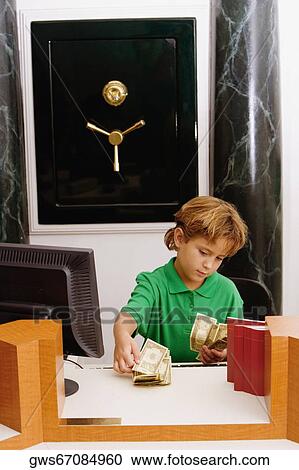 Boy counting currency notes View Large Photo Image Stock Image - Boy counting currency notes. Fotosearch