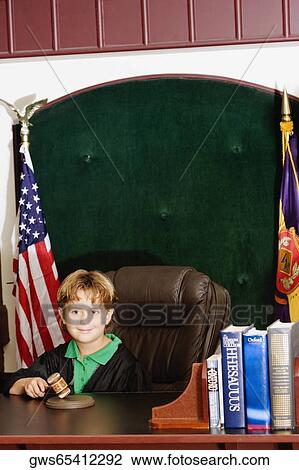 Boy imitating a judge in a courthouse View Large Photo Image Stock Image - Boy imitating a judge in a courthouse. Fotosearch