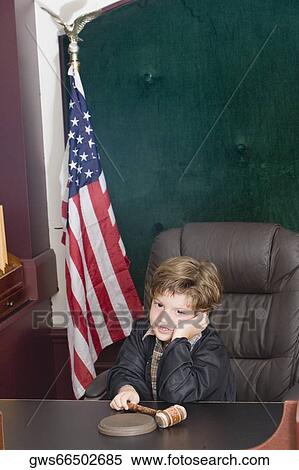 Boy imitating a judge View Large Photo Image Stock Photography - Boy imitating a judge. Fotosearch