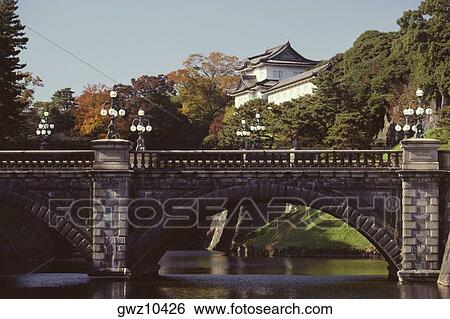 Bridge across a river with a palace in the background, Nijubashi Bridge, Imperial Palace, Tokyo Prefecture, Japan View Large Photo Image Stock Photograph - Bridge across a river with a palace in the background, Nijubashi Bridge, Imperial Palace, Tokyo Prefecture, Japan. Fotosearch