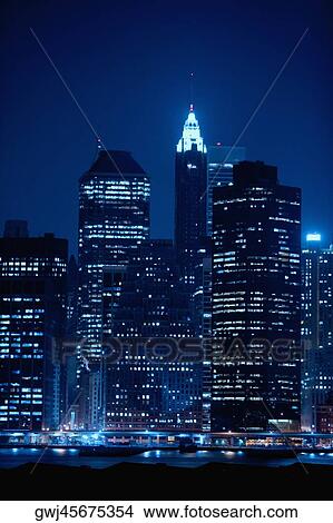 Picture - Buildings lit up at night, Chrysler Building, Manhattan, New York City, New York State, USA. Fotosearch