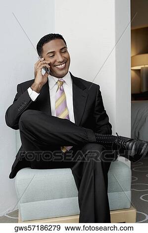 Businessman using a mobile phone View Large Photo Image Stock Photo - Businessman using a mobile phone. Fotosearch