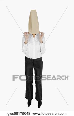 Businesswoman covering her face with a paper bag View Large Photo Image Stock Photo - Businesswoman covering her face with a paper bag. Fotosearch