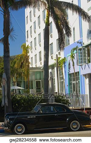Car parked in front of a building, Miami, Florida, USA View Large Photo Image Stock Photo - Car parked in front of a building, Miami, Florida, USA. Fotosearch