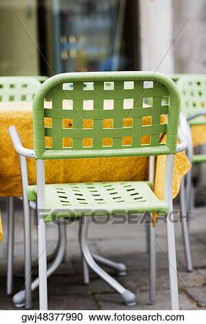 Chairs and tables at a sidewalk cafe, Venice, Veneto, Italy View Large Photo Image Stock Image - Chairs and tables at a sidewalk cafe, Venice, Veneto, Italy. Fotosearch