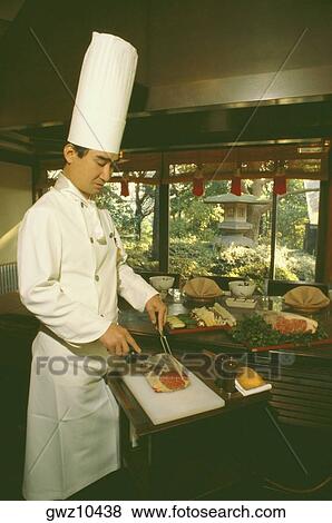 Chef preparing food in hotel kitchen, Tokyo Prefecture, Japan View Large Photo Image Stock Photo - Chef preparing food in hotel kitchen, Tokyo Prefecture, Japan. Fotosearch