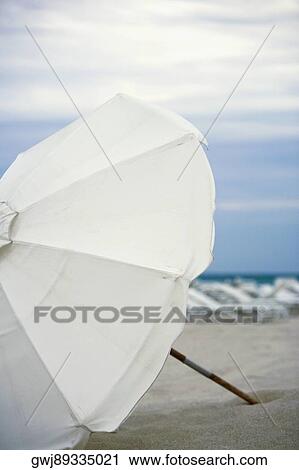 Stock Image - Close-up of a beach umbrella on the beach. Fotosearch