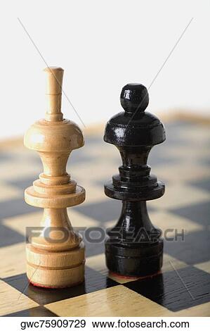 Close-up of a Bishop and a Queen on a chessboard View Large Photo Image Stock Photo - Close-up of a Bishop and a Queen on a chessboard. Fotosearch