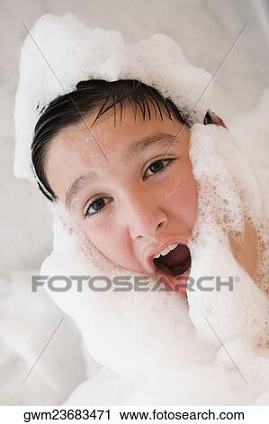 Close-up of a boy in a bubble bath View Large Photo Image Stock Image - Close-up of a boy in a bubble bath. Fotosearch