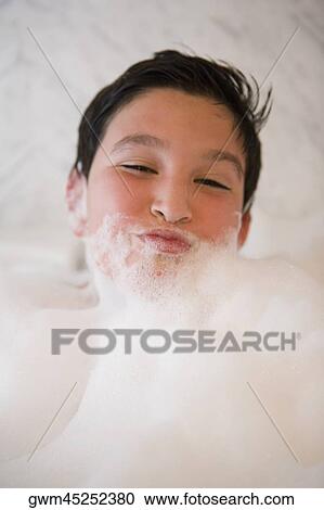 Close-up of a boy in a bubble bath View Large Photo Image Stock Image - Close-up of a boy in a bubble bath. Fotosearch