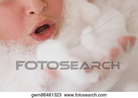 Close-up of a boy in a bubble bath View Large Photo Image Stock Image - Close-up of a boy in a bubble bath. Fotosearch