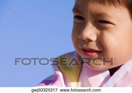 Close-up of a boy View Large Photo Image Stock Photo - Close-up of a boy. Fotosearch