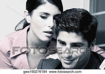 Close-up of a businessman and a businesswoman View Large Photo Image Picture - Close-up of a businessman and a businesswoman. Fotosearch