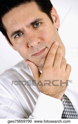 Close-up of a businessman looking worried View Large Photo Image Stock Image - Close-up of a businessman looking worried. Fotosearch