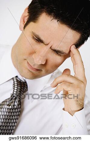 Stock Photograph - Close-up of a businessman looking worried. Fotosearch
