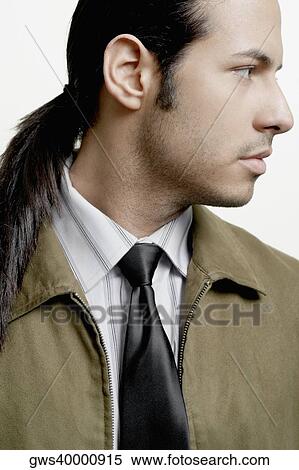 Stock Photography - Close-up of a businessman looking sideways. Fotosearch