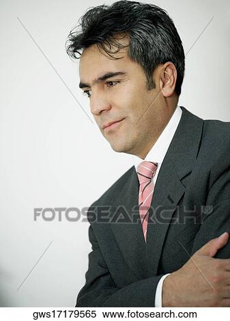 Stock Photography - Close-up of a businessman thinking. Fotosearch